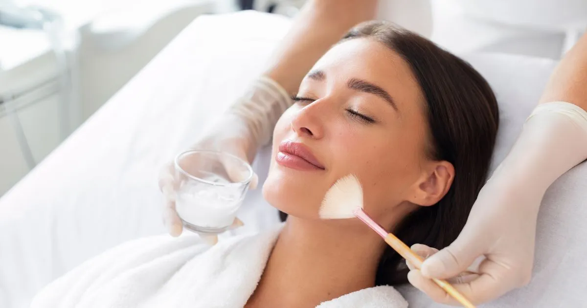 A woman receiving a chemical peel treatment on her face in Boynton Beach, FL